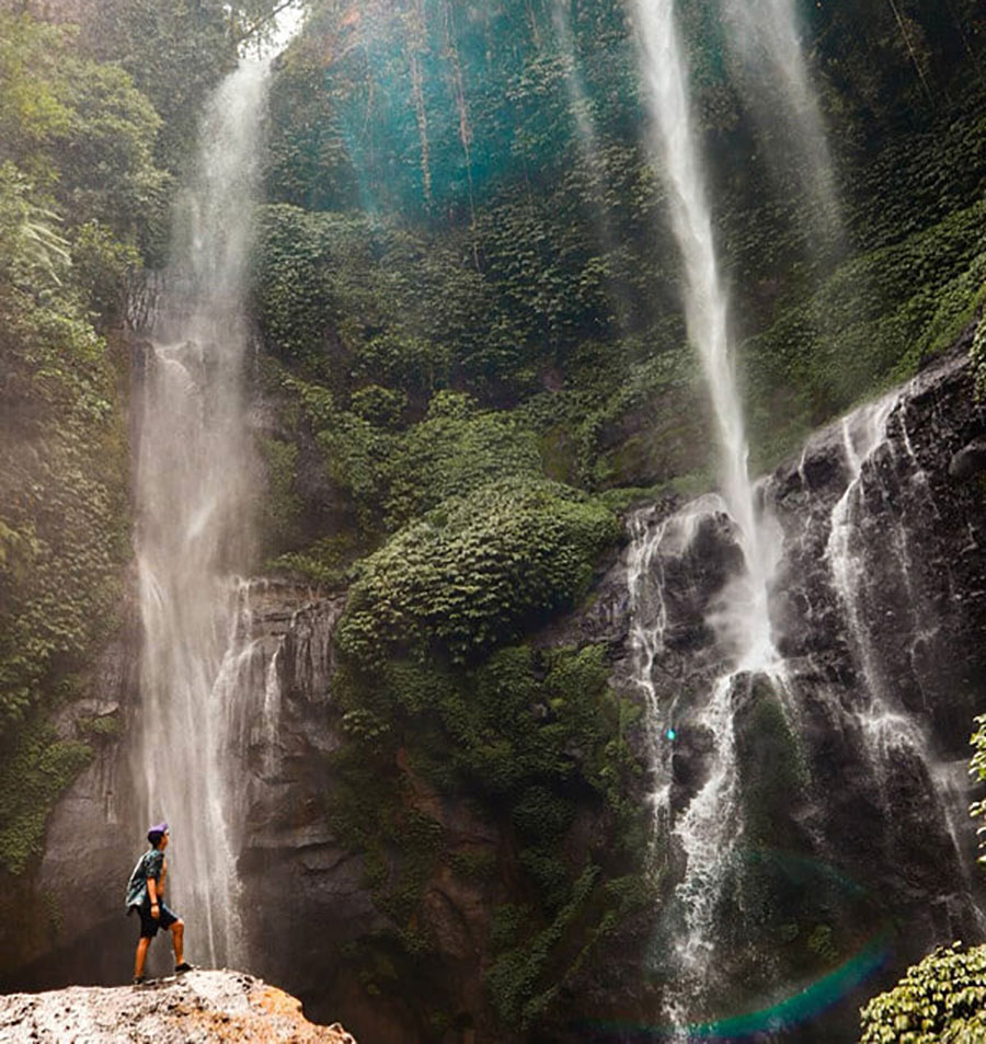 Bali waterfalls - Guy stays on the bottom of Sekumpul Waterfall.