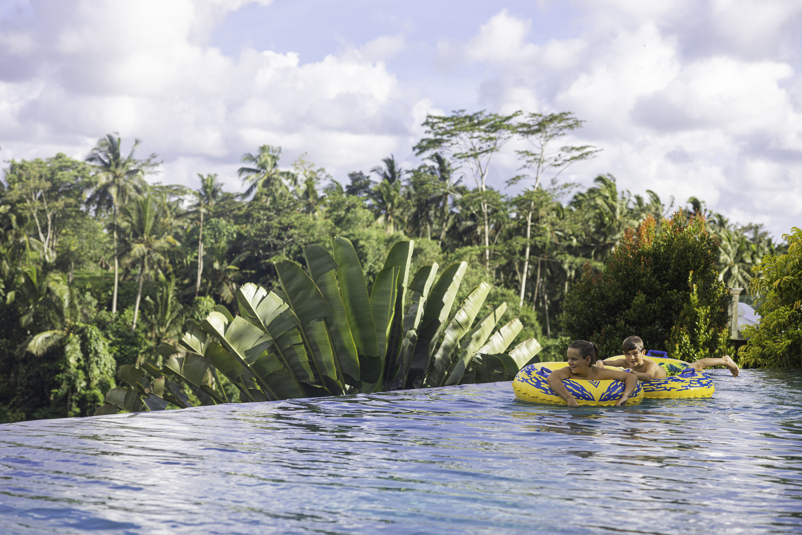 Kids enjoying main pool at viceroy bali