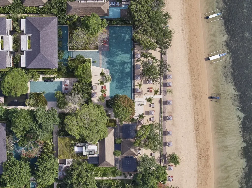 The aerial view of the pool and beach view of the Andaz Bali