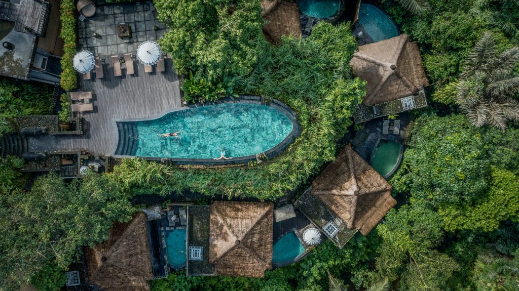 An aerial view of the villas and pool at The Kayon Resort