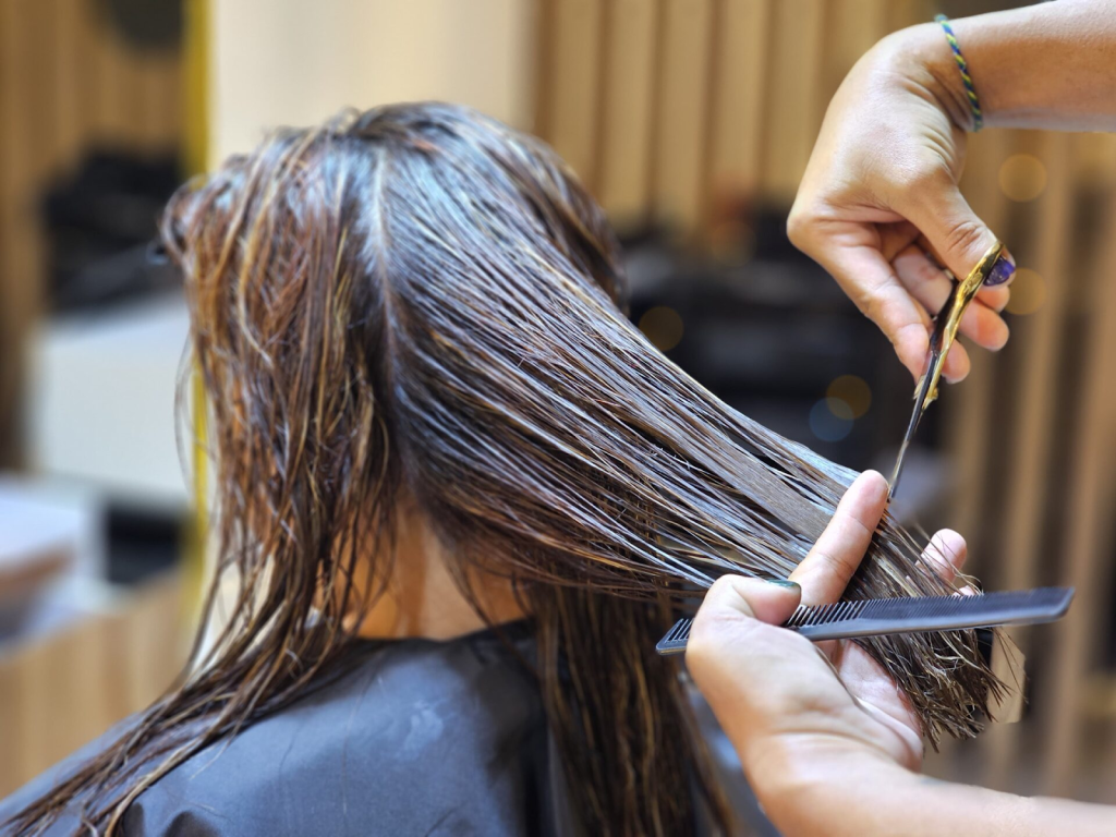 A woman having her hair cut