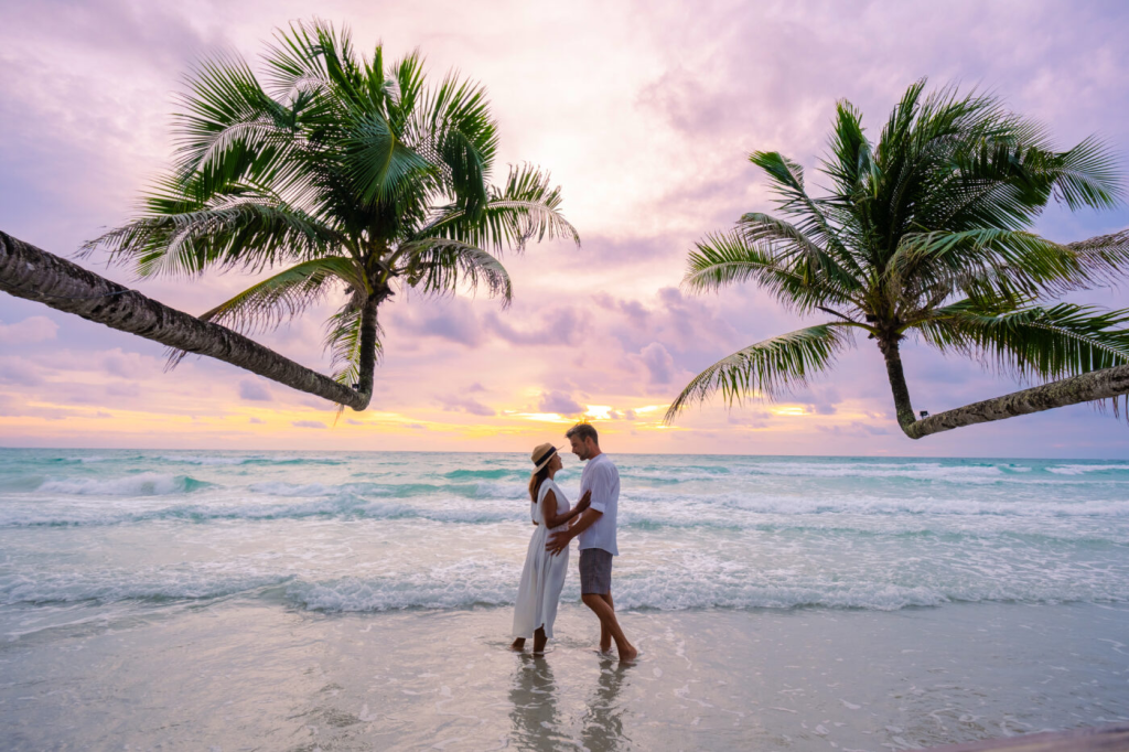 A couple on a romantic beach on their honeymoon