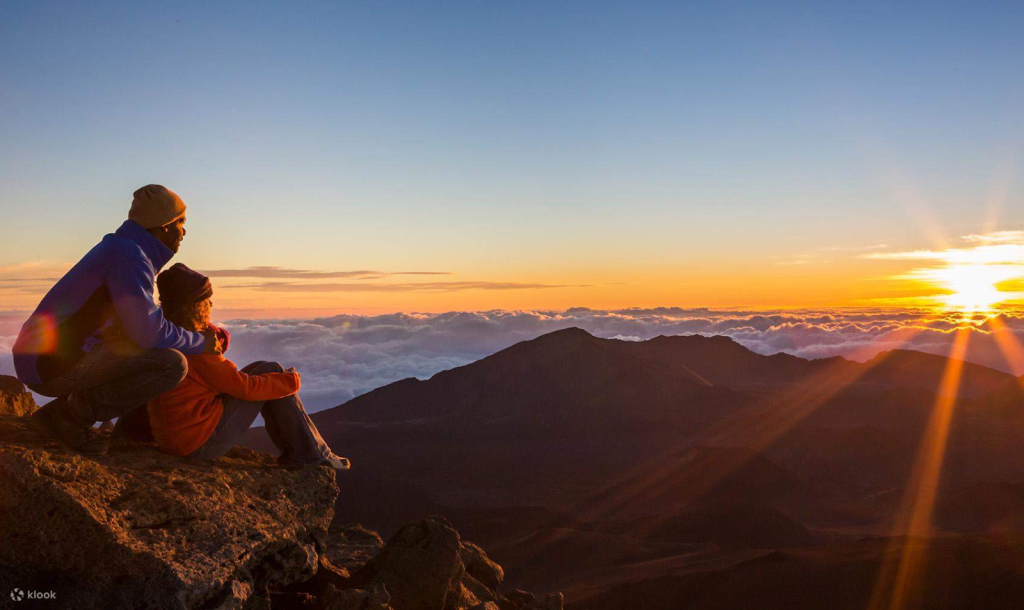 A couple watching the sunrise on Mount agung