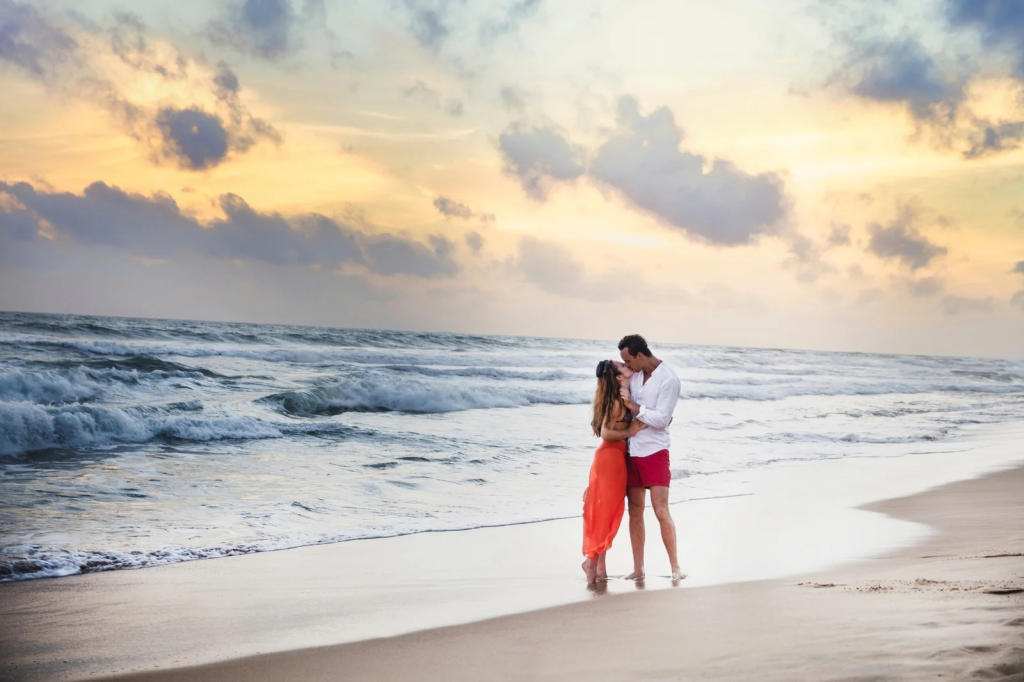 A couple standing on the beach on their honeymoon in Bali