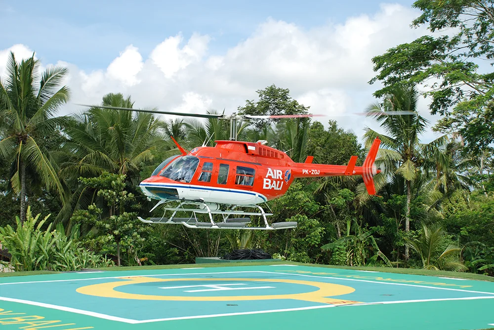 A helicopter landing on a hotel helipad