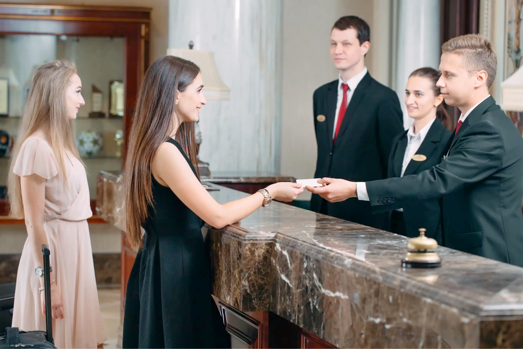 Staff providing services to a customer at a luxury hotel