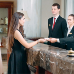 Staff providing services to a customer at a luxury hotel