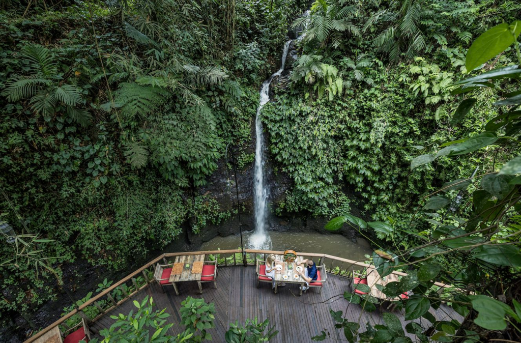The waterfall view from the deck at The Kayon Resort Ubud, Bali