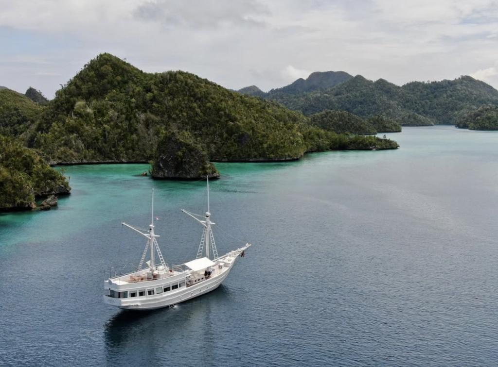 A luxury yacht sailing through Komodo Islands