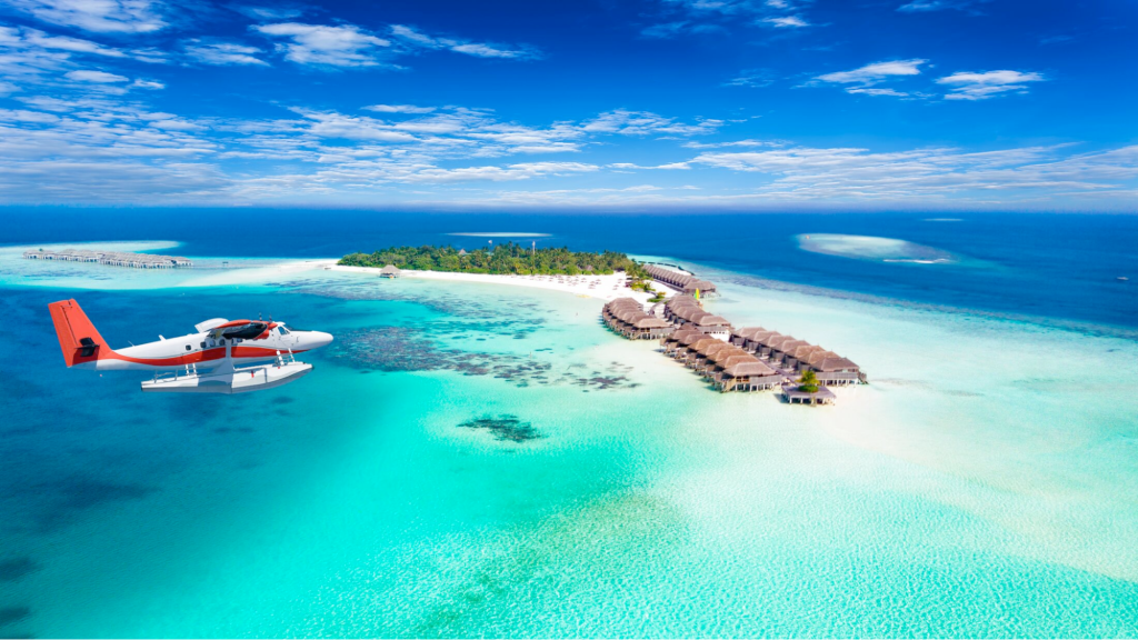 A seaplane flying over luxury overwater bungalows in Maldives
