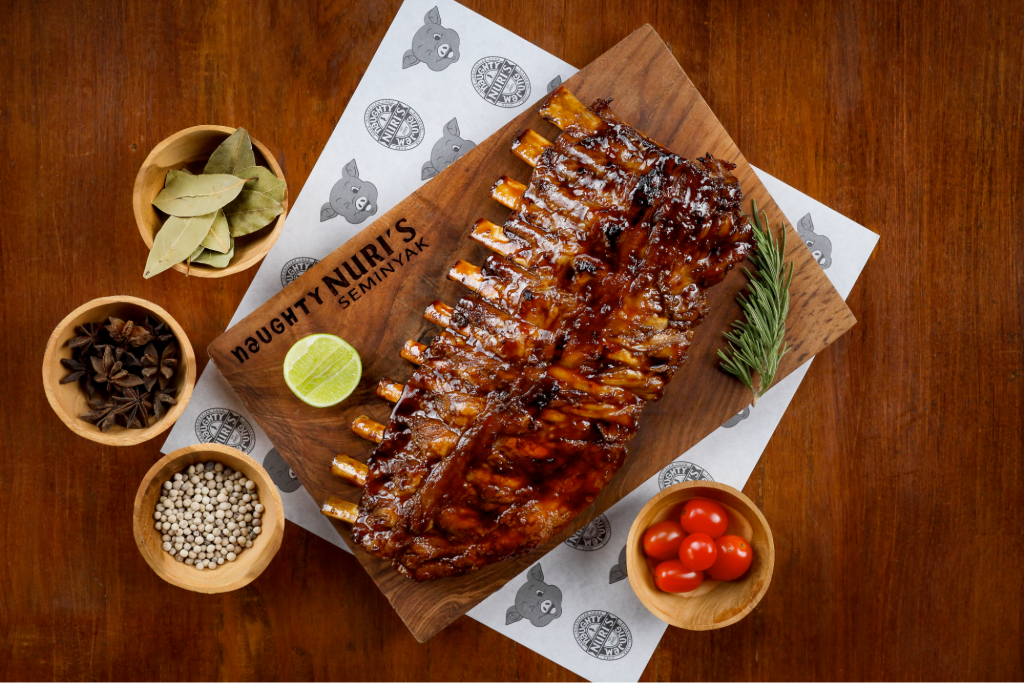 Pork ribs and garnishes from Naughty Nuri's Warung in Bali